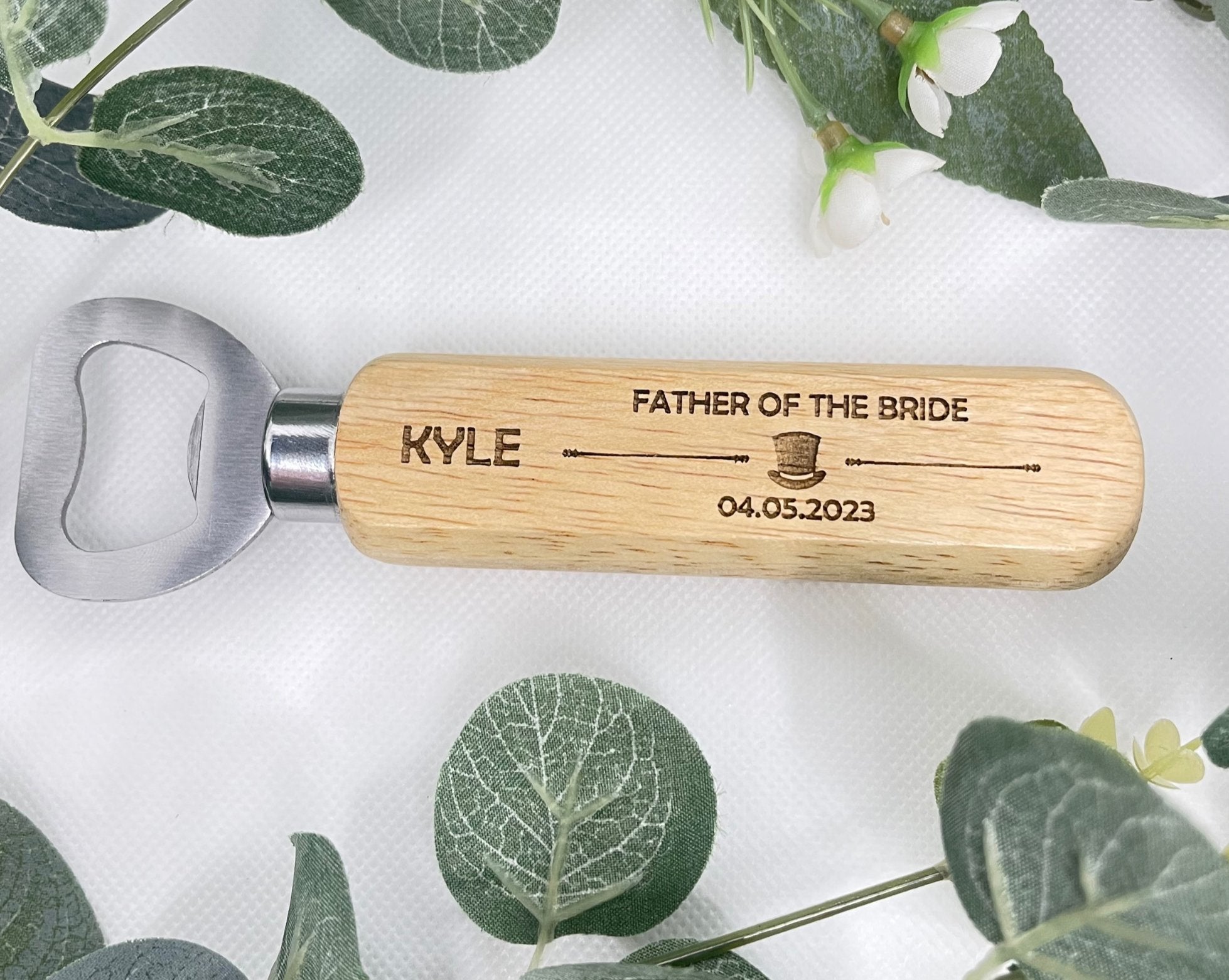 Celebrate your special day with our charming Personalised Wedding Bottle Openers. Handcrafted and laser-engraved with a whimsical hat image, these keepsakes make the perfect wedding or Stag Do gift. With durable stainless steel and natural wood design, each opener is personalised with the recipient's name, role, and wedding date. An ideal memento that combines practicality and sentiment. Remember to hand wash only. Personalisation details needed: name, wedding role, and date.