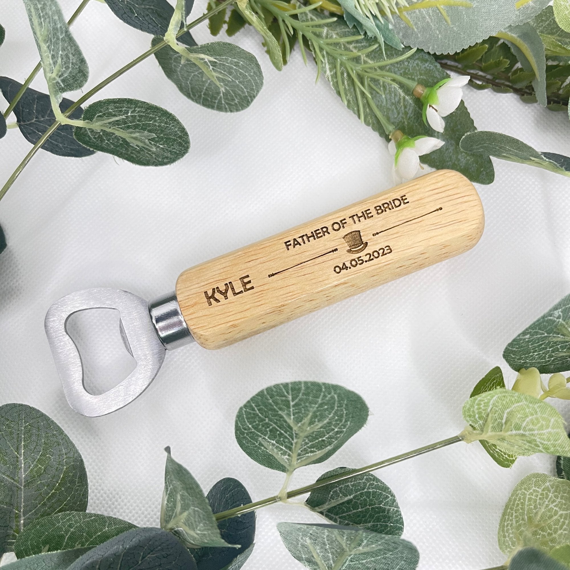 Make a toast to friendship and memorable moments with our Personalised Wedding Bottle Openers. Each piece, laser-engraved with a fun hat image, commemorates your special day while serving as a useful keepsake. Crafted from durable stainless steel and wood, these openers are personalised with the recipient's name, their role in the wedding, and the date of the event. A lasting memento that's both stylish and functional. Please hand wash only. For personalisation, provide: name, role, and wedding date.