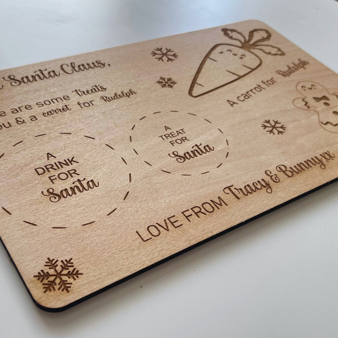 Make Christmas Eve extra special with our Personalised Santa Plate. Customisable for up to three names, complete with dedicated sections for Santa's treats, drink, and Rudolf's carrot, embellished with delightful gingerbread and snowflake engravings. Crafted from 4mm beech veneer, sized at 290mm x 185mm.