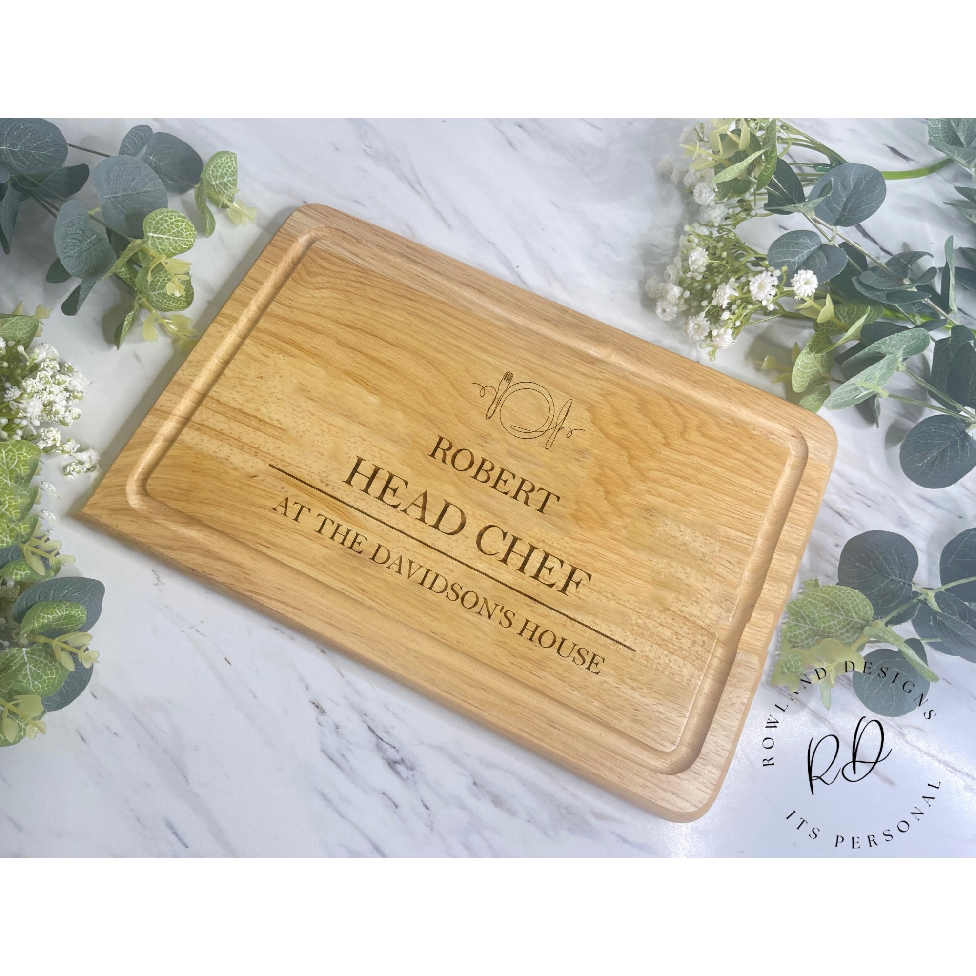Add warmth to your kitchen or share the love with our Personalised Chopping Board - Knife & Fork Design. Laser-engraved on Beech Wood, personalize yours today for a unique touch. All text in caps. Order now to elevate your celebrations with the magic of personalisation. Measures 300mm x 200mm. Hand wash only, not dishwasher safe. 📦❤️