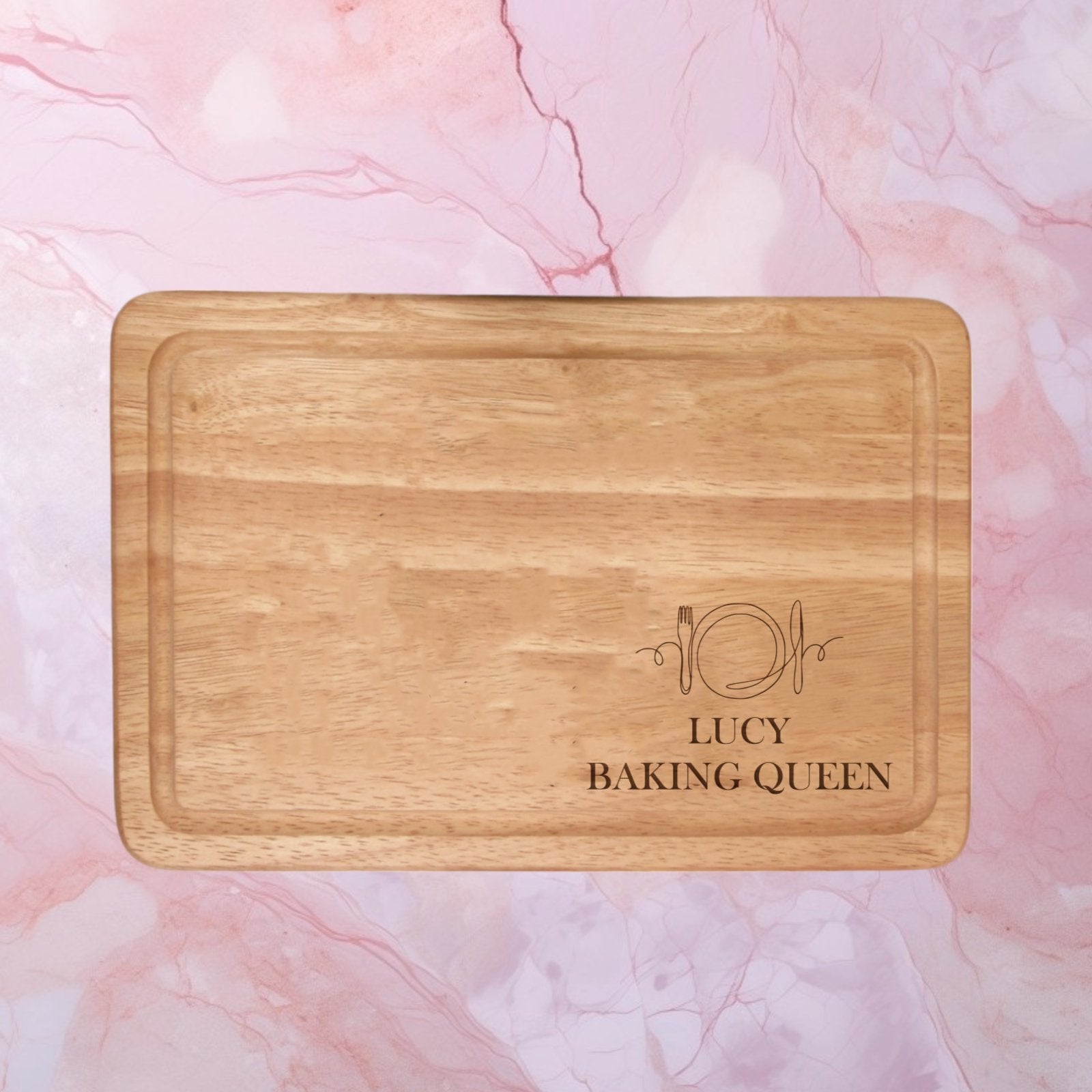 Elevate your kitchen aesthetic with our Personalised Chopping Board Knife & Fork Design. Engrave two lines of text (max 20 characters each in caps) on this premium wood board, making it a perfect blend of style and sentiment. Ideal for housewarmings, weddings, or anniversaries, this versatile and classy board adds a personal touch to your cooking routine. Crafted for a special culinary experience, it’s a thoughtful and stylish gift for any occasion.