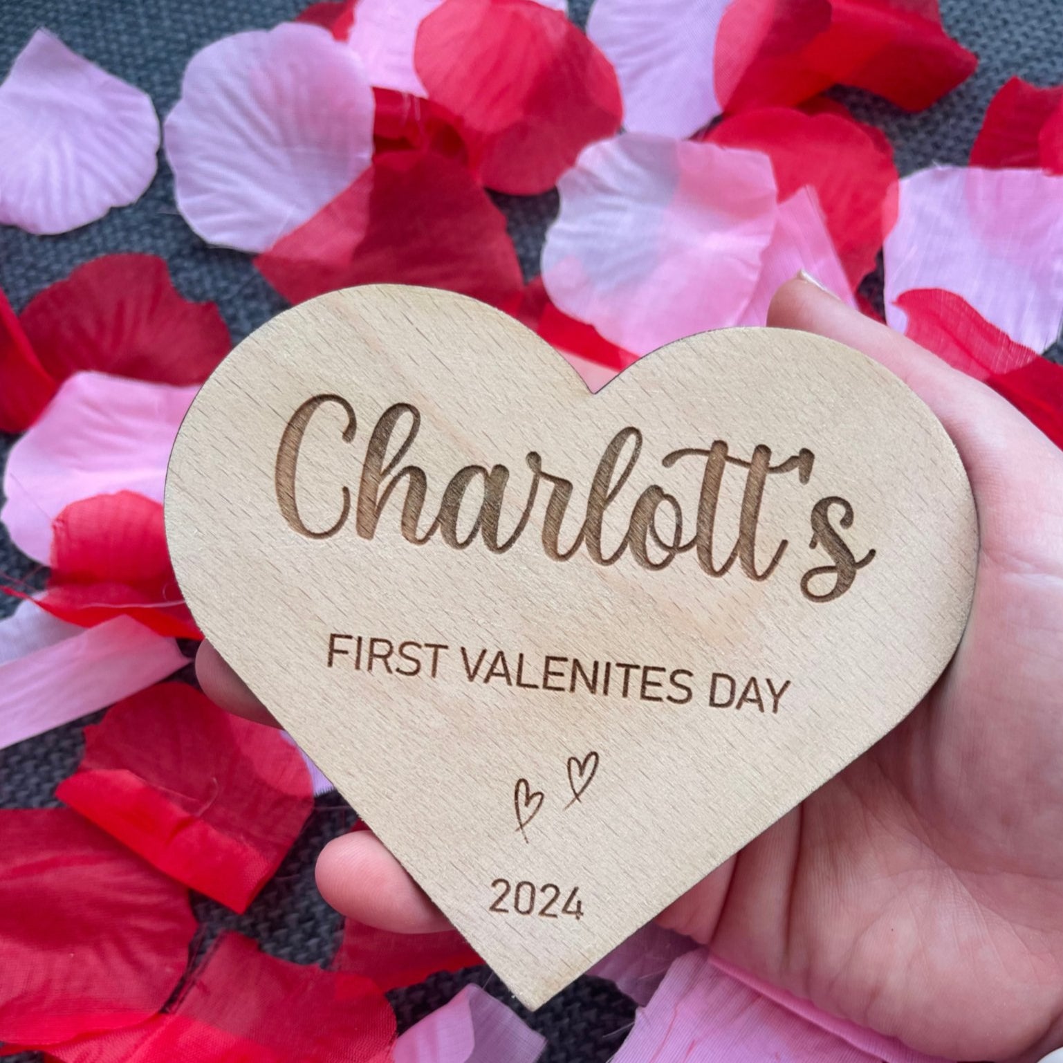Cherish your baby's first Valentine's with a personalised heart-shaped plaque, meticulously engraved with your baby's name. Crafted from quality beech veneer, the plaque measures 115mm x 100mm, 4mm thick – an ideal gift for new parents, adding beauty to baby photographs.