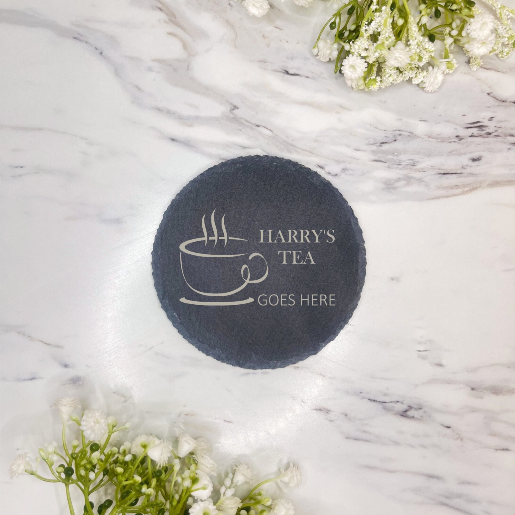 Personalised laser-engraved round slate coaster with custom name and coffee cup design, a charming and practical gift idea for coffee lovers