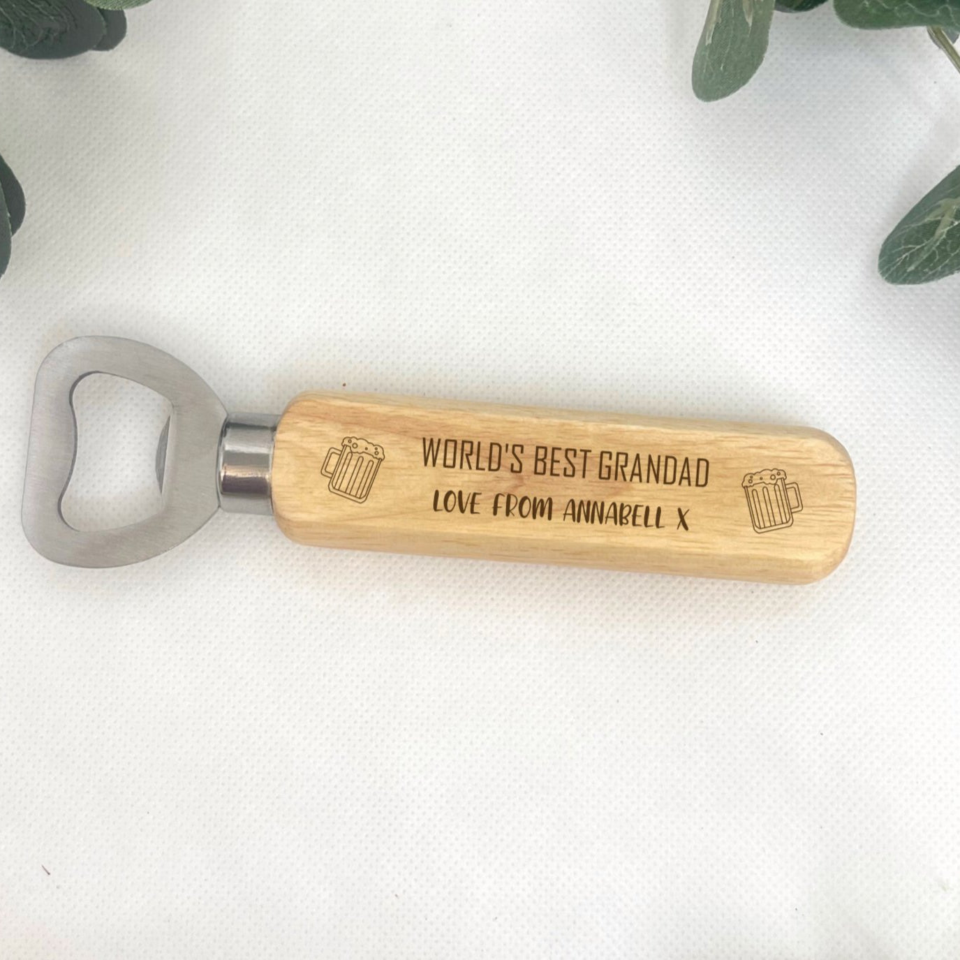 Personalised Wooden Bottle Opener - Handcrafted from top-quality wood and stainless steel - Customisable 'World's Best' engraving - Add a heartfelt 'love from' message - Charming beer jug icon - The perfect gift for Dad, Uncle, Grandfather, or any loved one.
