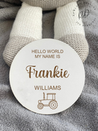 A personalised pregnancy announcement sign with a charming tractor design, meticulously crafted from premium beech veneer, perfect for celebrating your new arrival.