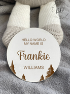 A close-up view of a white MDF baby announcement plaque with a detailed tree motif, showcasing engraved details that add a natural touch to any nursery decor.