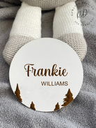 Close-up of a white MDF baby announcement plaque featuring an intricately engraved tree motif and personalised with the baby's name, perfect for nursery decor.