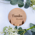 A round personalised baby announcement plaque with a delicate tree design, crafted from premium beech veneer, showcasing the baby's first and last names in elegant script.