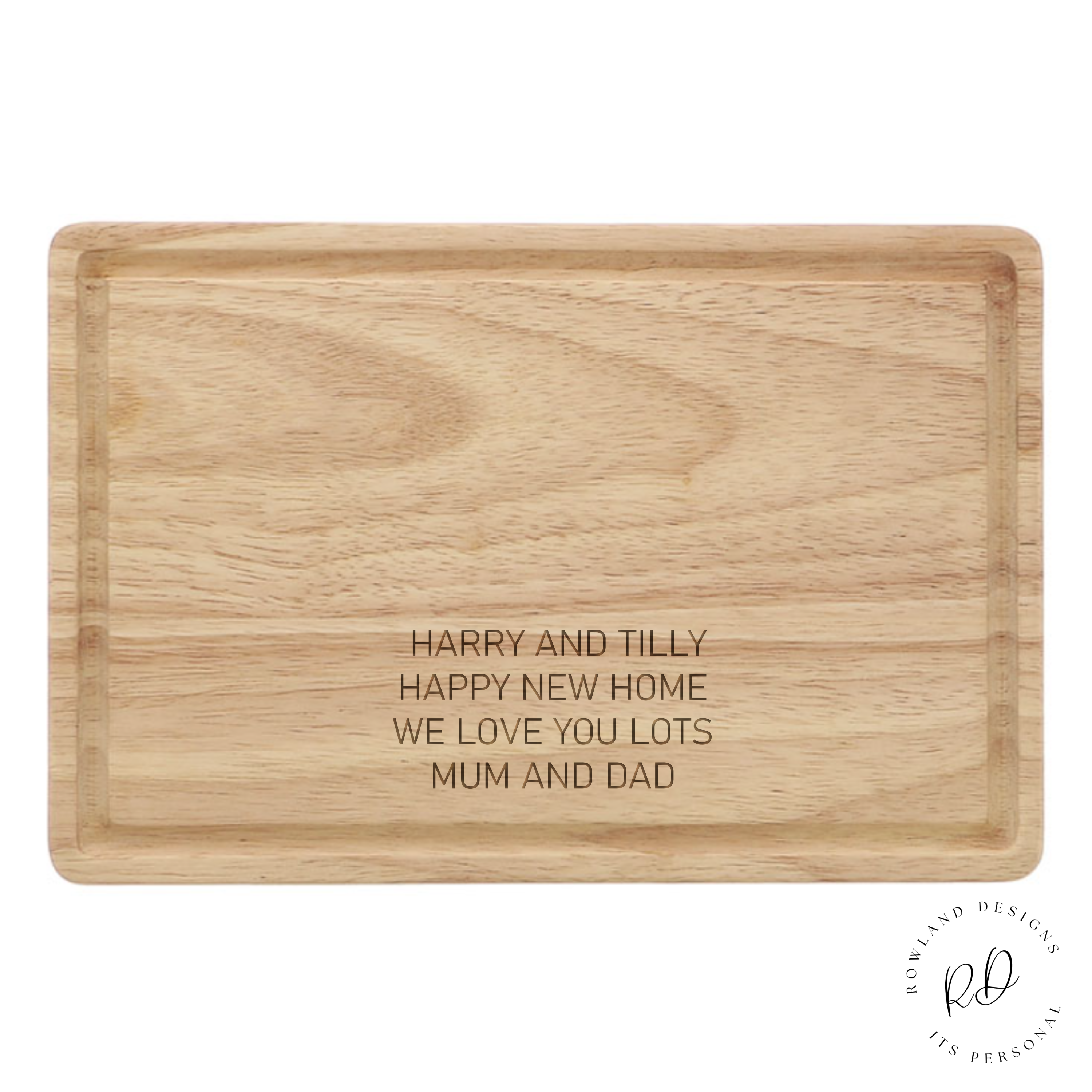 Personalised wooden cutting board displayed in a kitchen setting, showing the four-line engraved message and its natural, eco-friendly material.