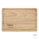 Personalised wooden chopping board engraved with 'Kitchen', . Ideal gift for aspiring chefs and culinary enthusiasts.