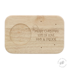 Image of a Personalised Santa's Tea & Biscuit Board for Christmas, featuring a festive Santa print, a built-in slot for holding a warm drink, and ample space for biscuits and cakes. This wooden board can be custom engraved with a personal message.