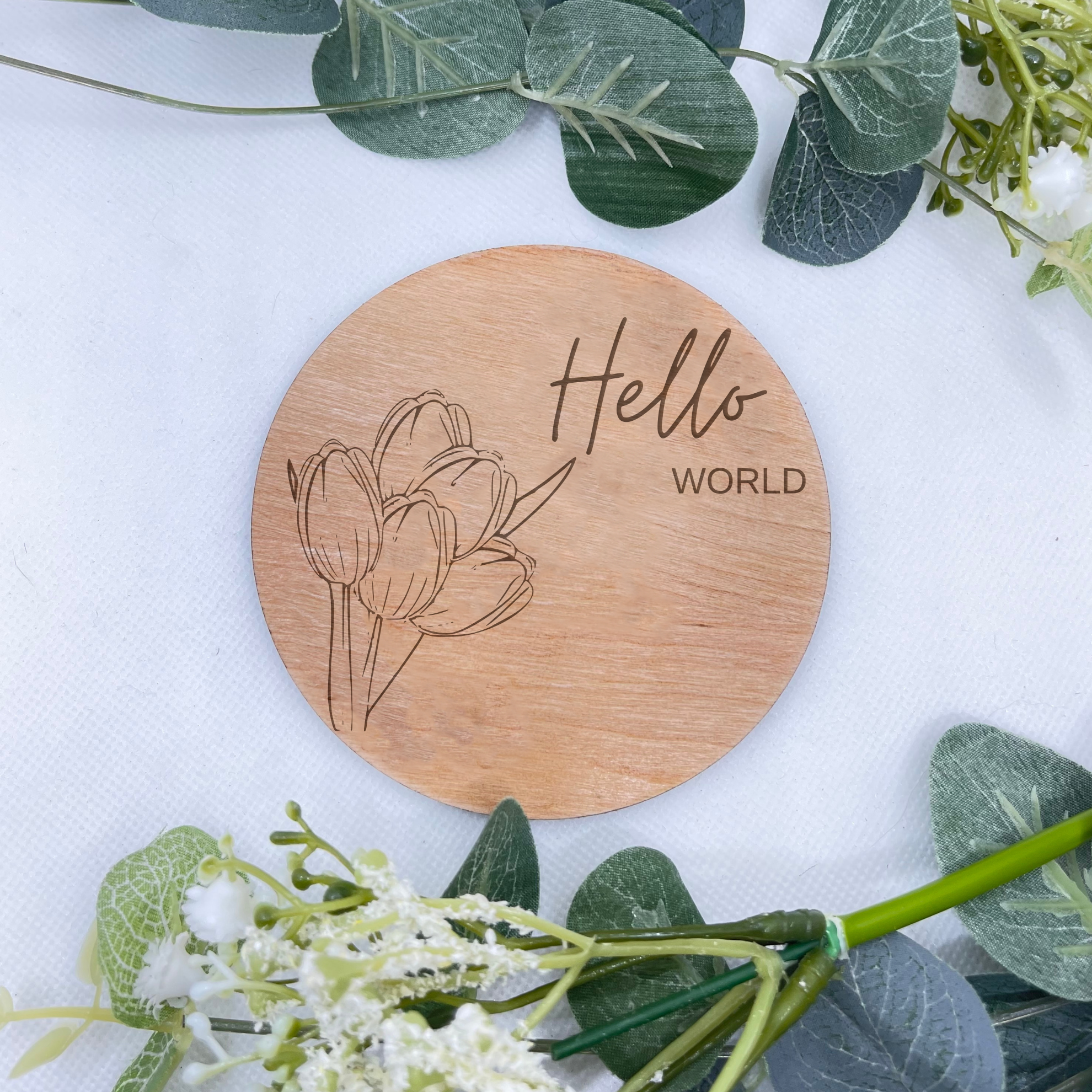 Capture the essence of timeless joy with our 'Hello World' Baby Plaque, adorned with delicate roses, creating an elegant backdrop for your cherished memories.