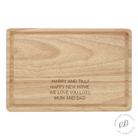 Personalised rectangle wooden chopping board set on a kitchen counter, featuring a four-line custom message, elegant design, and eco-friendly material.