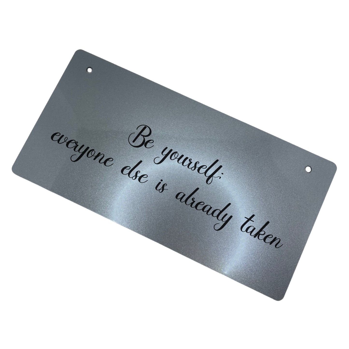 Unique acrylic sign in silver or gold with black twine hanging. Features the quote 'Be yourself; everyone else is already taken.' Perfect for home decor and as a heartfelt gift.