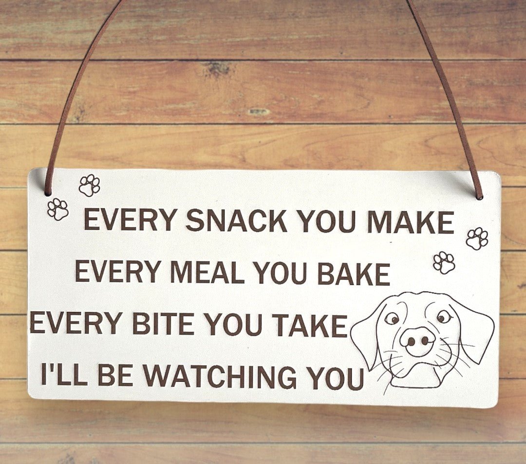 Plaque Size: 220 x 110 mm (approx) Thickness: 3mm Text reads: Every snack you make every meal you bake every bite you take i'll be watching you Suitable For: Dog Signs For Home, Gifts For Dog Lovers, Dog Signs And Plaques, Funny Dog Sign, Birthday Gift Style: Contemporary Material: White coated MDF with brown faux leather hanger Indoor use only Made in England