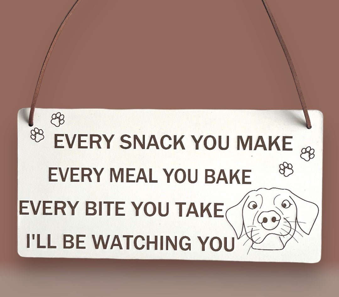 Plaque Size: 220 x 110 mm (approx) Thickness: 3mm Text reads: Every snack you make every meal you bake every bite you take i'll be watching you Suitable For: Dog Signs For Home, Gifts For Dog Lovers, Dog Signs And Plaques, Funny Dog Sign, Birthday Gift Style: Contemporary Material: White coated MDF with brown faux leather hanger Indoor use only Made in England