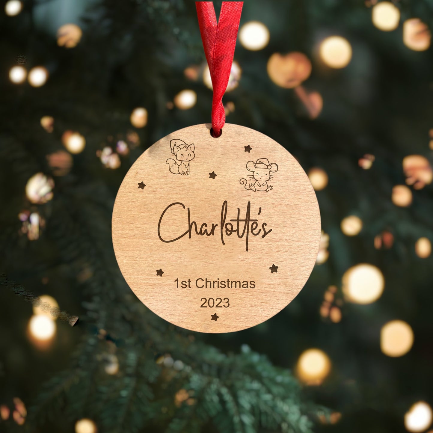 Create lasting memories with our one-of-a-kind Premium Beech Veneer Baby's First Christmas Bauble. This heartwarming ornament boasts a delightful Fox and Mouse Design that adds a touch of whimsy to your tree. Customised with your baby's name and '1st Christmas 2023,' it's the perfect Unique Family Tradition and a meaningful keepsake for many Christmases to come.