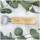  Close-up of a personalized bottle opener with a classic wooden handle and metallic opener, perfect as a thoughtful thank-you gift for weddings or birthdays.