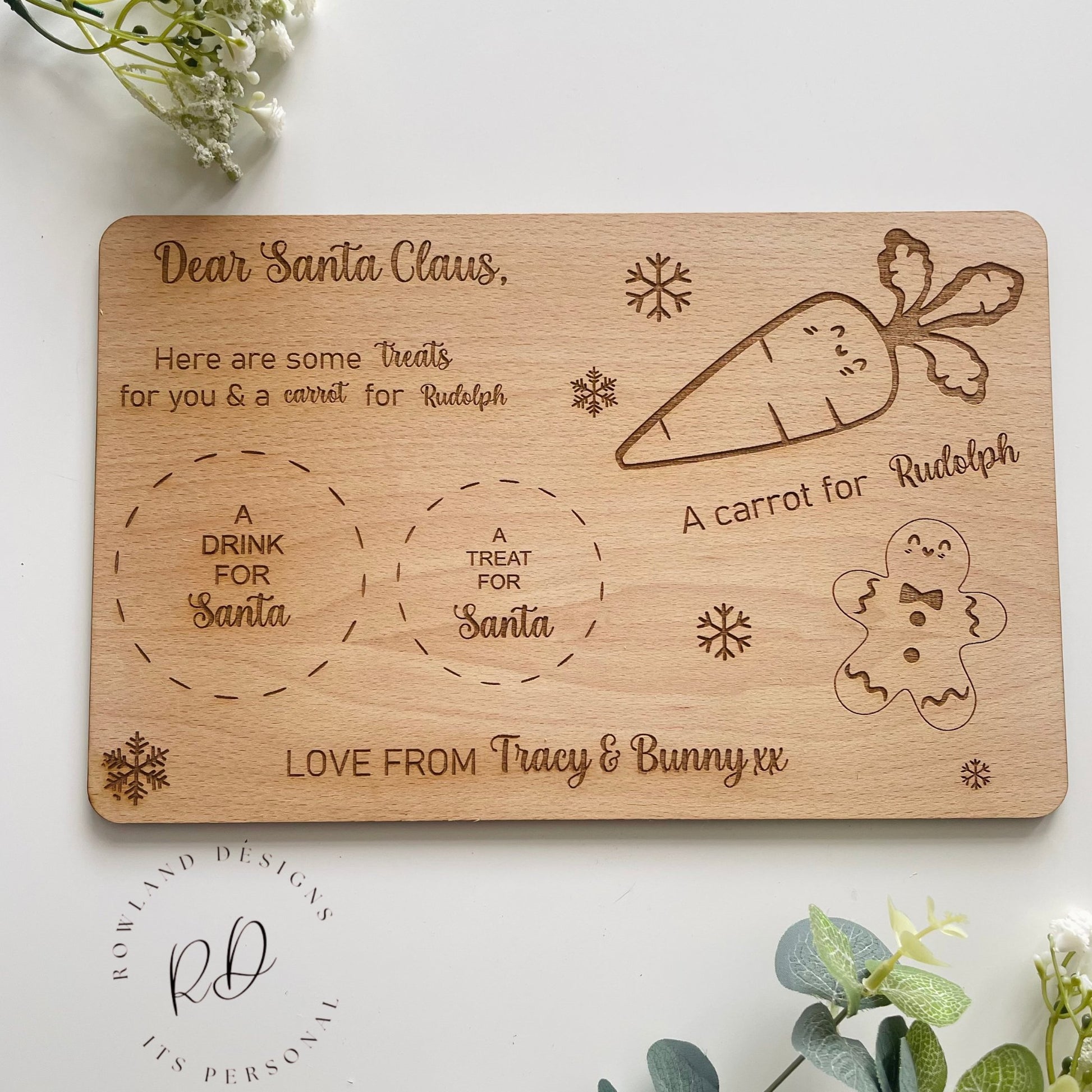 Make Christmas Eve extra special with our Personalized Santa Plate. Customizable for up to three names, complete with dedicated sections for Santa's treats, drink, and Rudolf's carrot, embellished with delightful gingerbread and snowflake engravings. Crafted from 4mm beech veneer, sized at 290mm x 185mm.