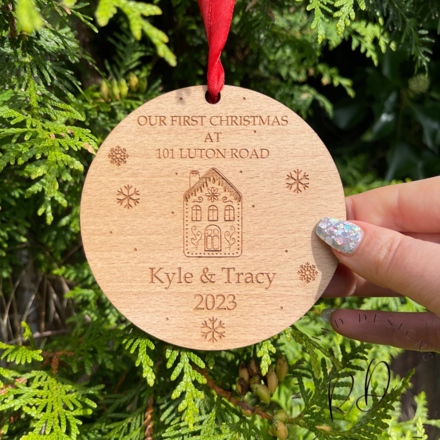 Capture the magic of your first home Christmas with our Personalized First Home Christmas Ornament. Customize it with your home's name and street, the couple's names, and the year. This 100mm x 100mm ornament is beautifully crafted from 4mm beech veneer and includes a festive red ribbon. The perfect holiday gift to cherish those special memories.