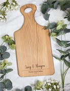 Personalized serving board featuring the words 'Home Sweet Home' surrounded by a heart. A perfect housewarming gift or a special present for couples celebrating weddings, anniversaries, birthdays, or any occasion worth cherishing. This board serves as a heartfelt token or a way to express gratitude. Let it be a joyful reminder of your loved one with each use.